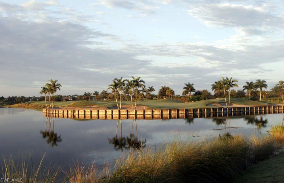10341 Heritage Bay Boulevard, Unit 1924 Naples, FL 34120 - Photo 34 of 36 a view of swimming pool with outdoor seating and lake view