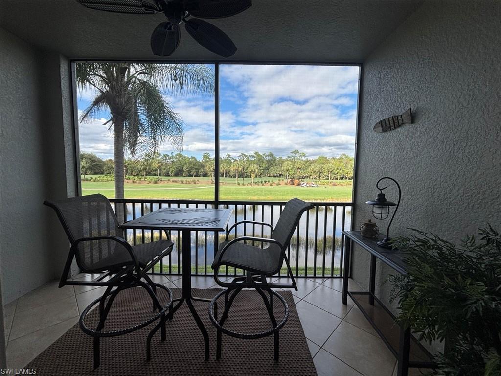 10341 Heritage Bay Boulevard, Unit 1924 Naples, FL 34120 - Photo 6 of 36 a view of a balcony with chairs and a potted plant