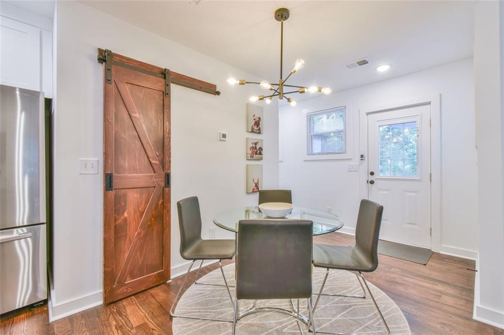 1225 Carter Road Decatur, GA 30030 - Photo 13 of 20 a view of a dining room with furniture and wooden floor