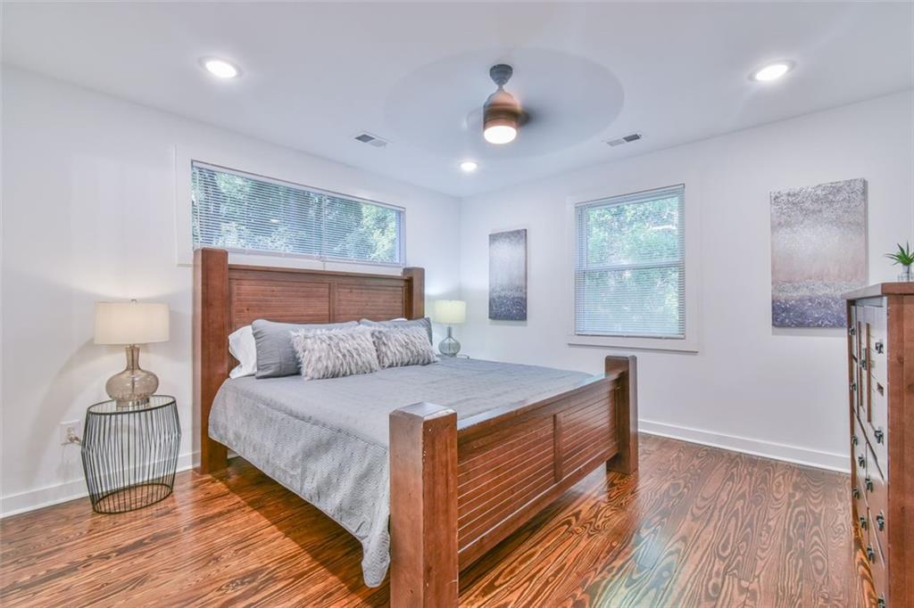 1225 Carter Road Decatur, GA 30030 - Photo 14 of 20 a bedroom with a bed and wooden floor
