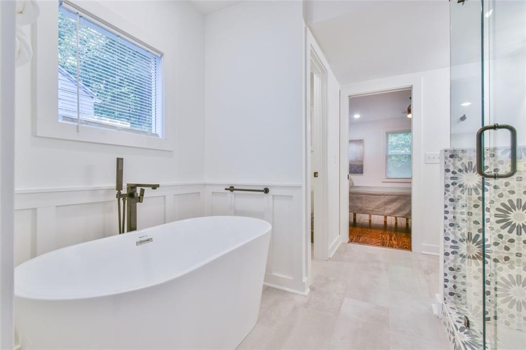 1225 Carter Road Decatur, GA 30030 - Photo 16 of 20 a bathroom with a bathtub and a shower