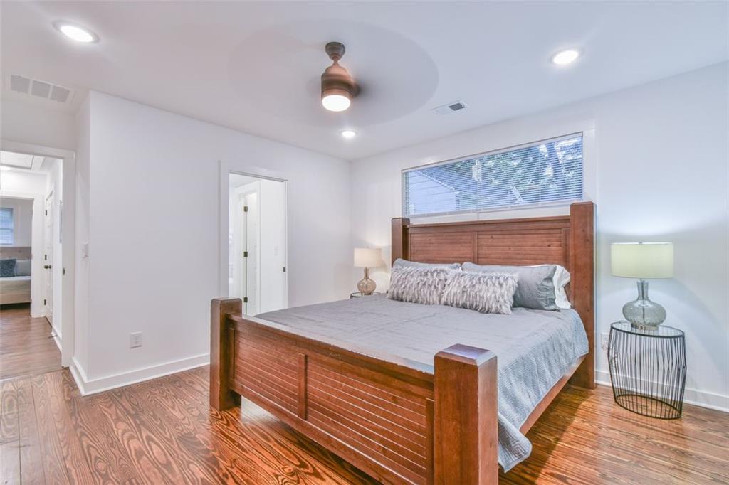1225 Carter Road Decatur, GA 30030 - Photo 4 of 20 a bedroom with a bed and wooden floor