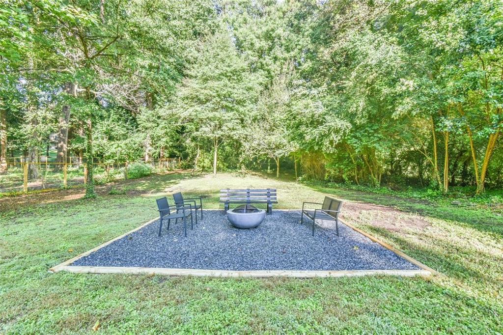 1225 Carter Road Decatur, GA 30030 - Photo 8 of 20 a view of a backyard with table and chairs
