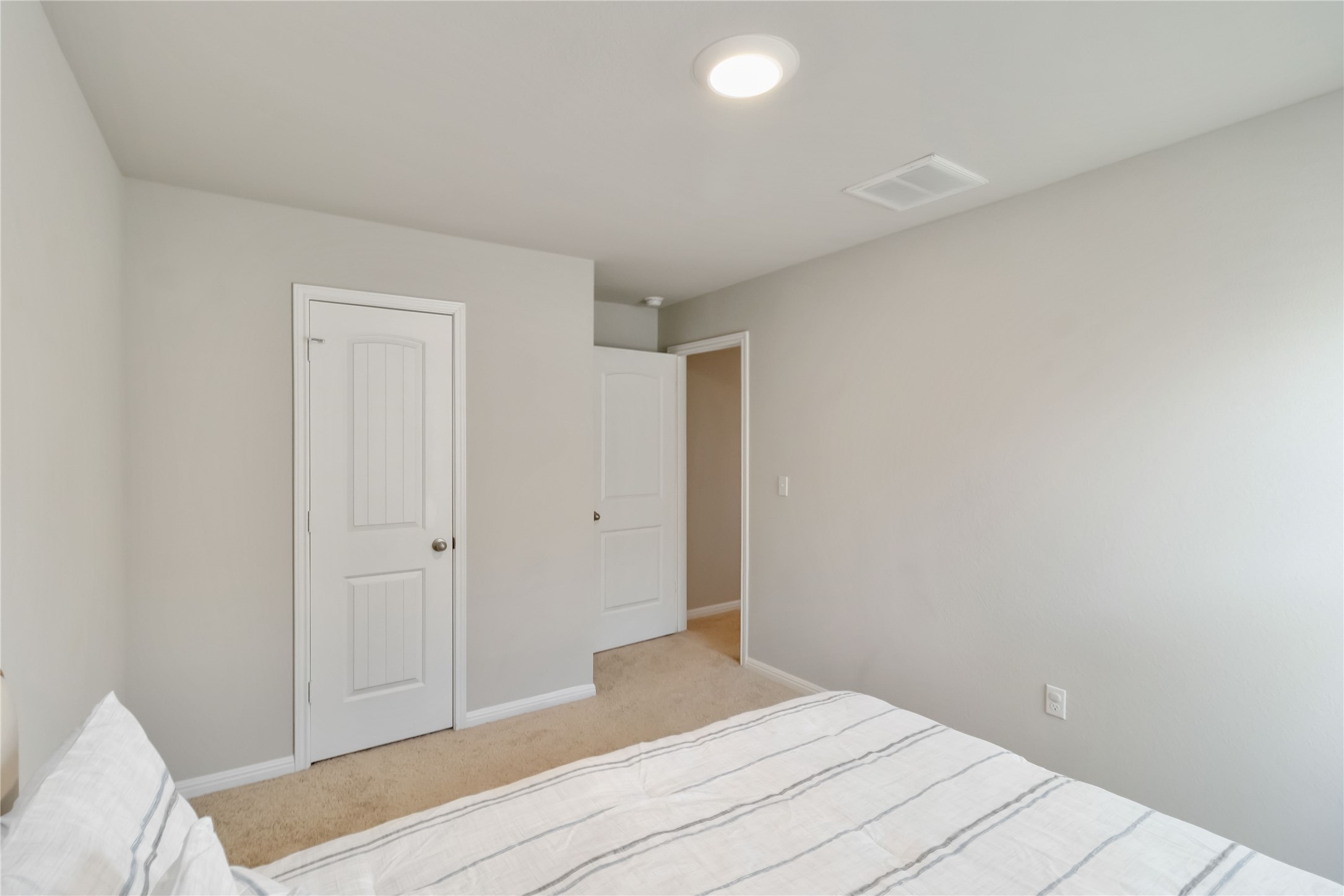 103 Mariners Landing Bastrop, TX 78602 - Photo 11 of 25 a bedroom with a bed and a lamp