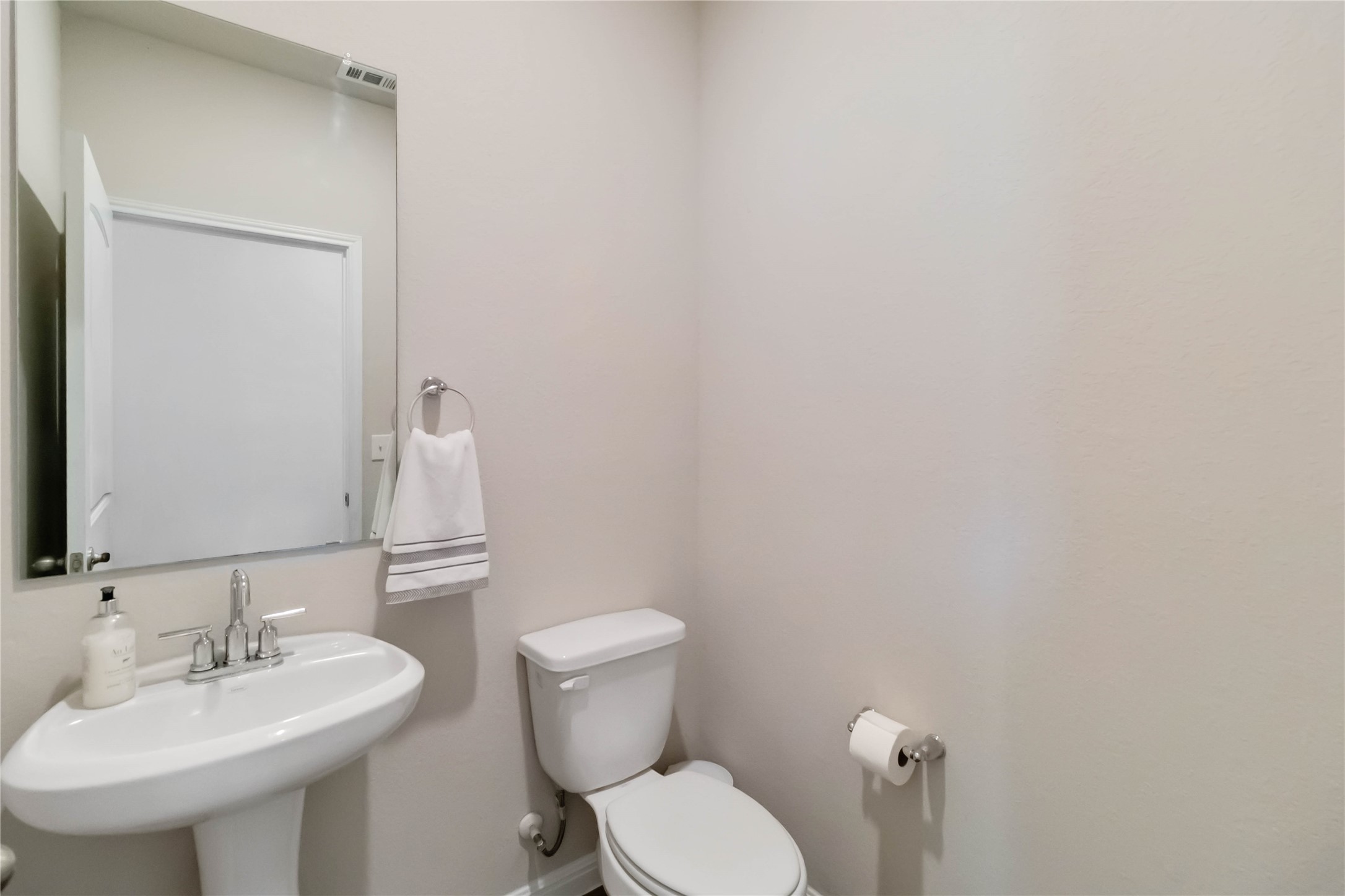 103 Mariners Landing Bastrop, TX 78602 - Photo 12 of 25 a bathroom with a toilet a sink and mirror