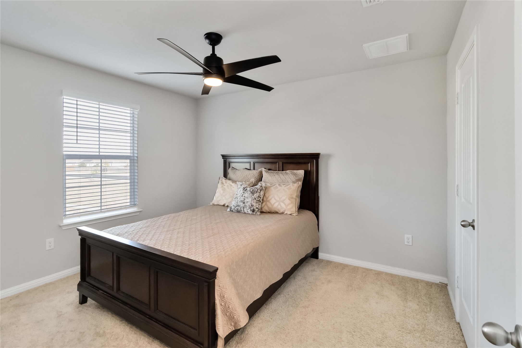 103 Mariners Landing Bastrop, TX 78602 - Photo 17 of 25 a bed sitting in a bedroom next to a window