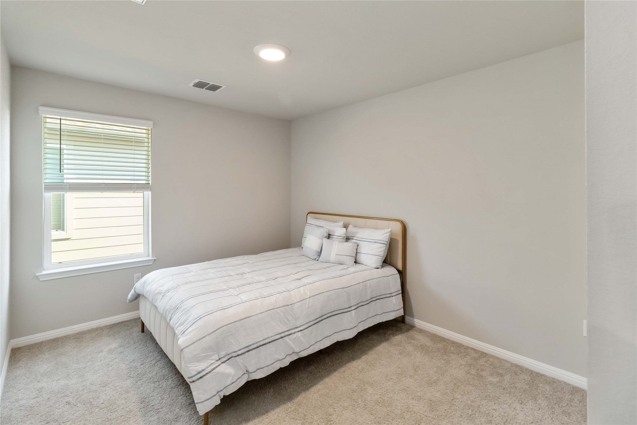 103 Mariners Landing Bastrop, TX 78602 - Photo 20 of 25 a bedroom with a bed and a window