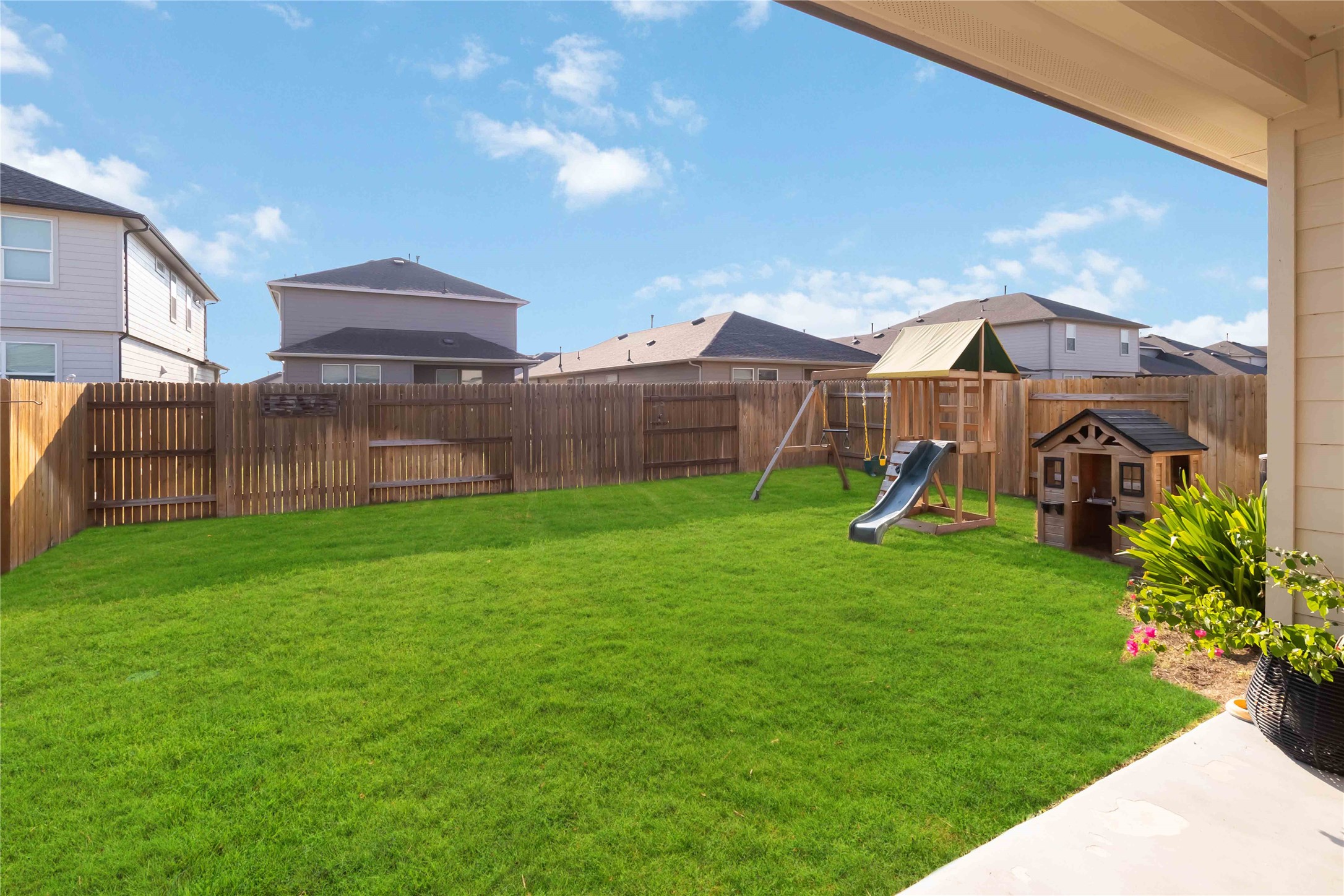 103 Mariners Landing Bastrop, TX 78602 - Photo 21 of 25 a view of a front of a house with a yard table and chairs