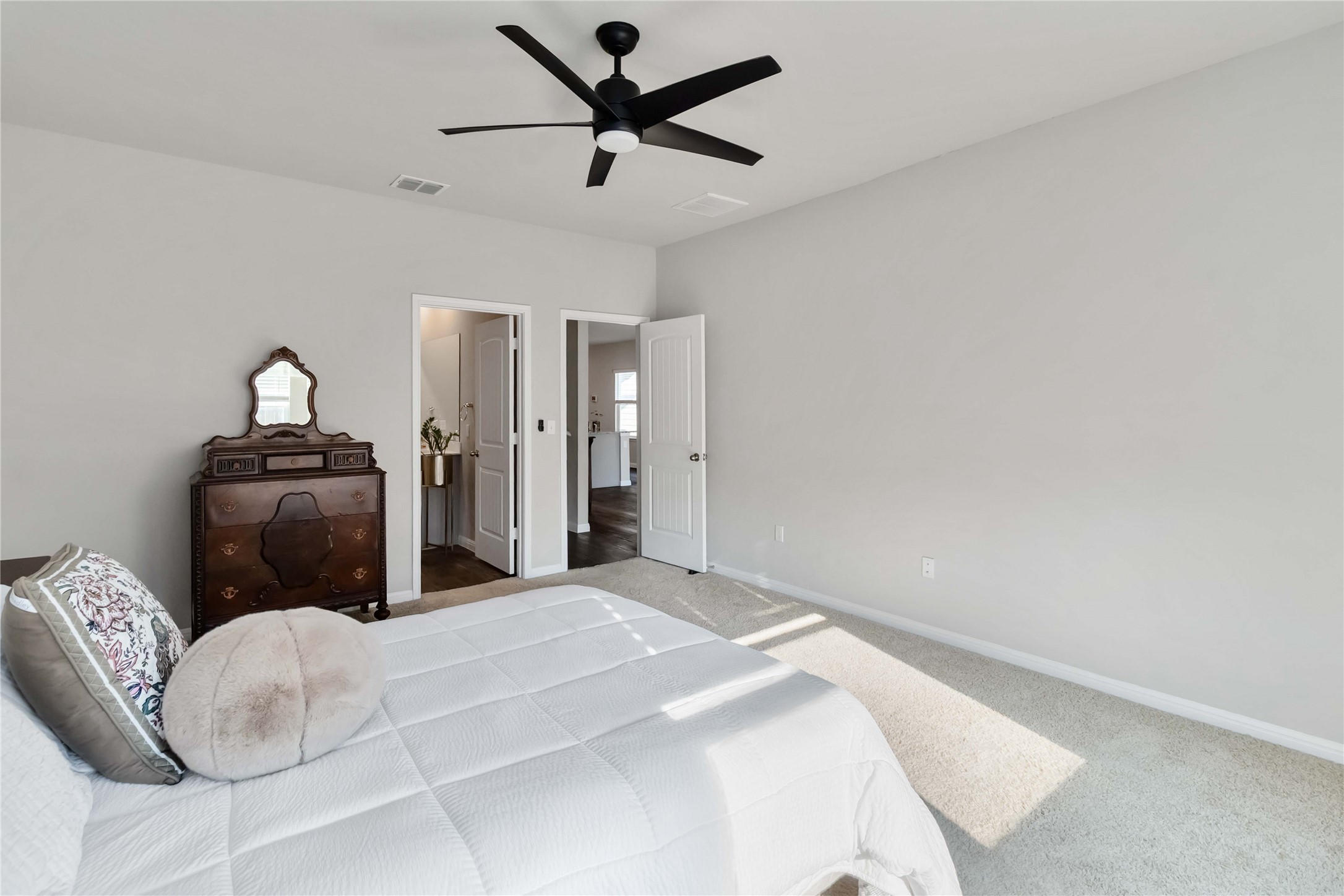 103 Mariners Landing Bastrop, TX 78602 - Photo 8 of 25 a bedroom with a bed and a chandelier