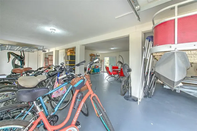 a living room with furniture a large window and flat screen tv