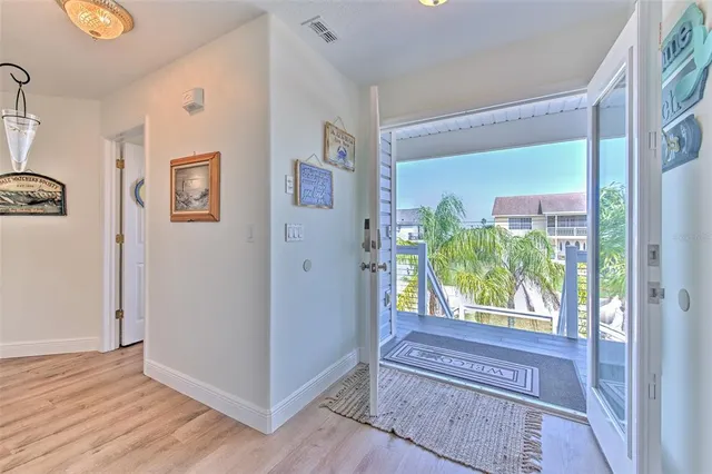 a living room with furniture a table and a chandelier