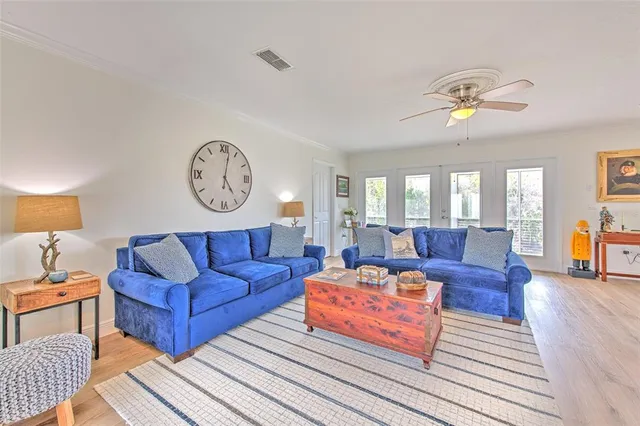 a kitchen with stainless steel appliances granite countertop a stove a sink a dining table and chairs