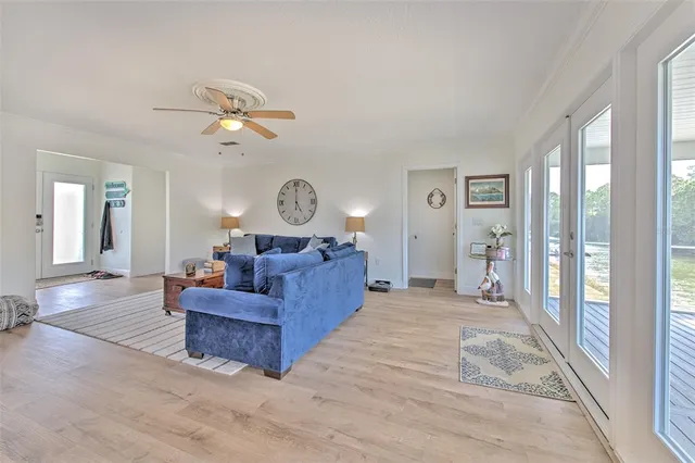 a view of a dining room with a table and chairs