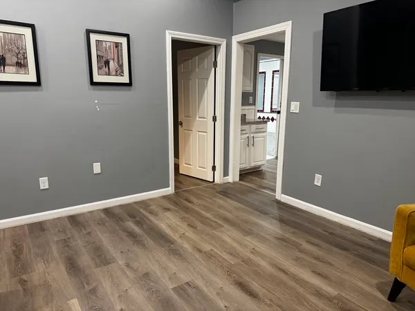a view of a livingroom with wooden floor