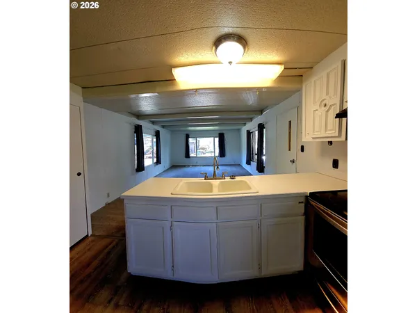 a view of living room with granite countertop furniture and fireplace