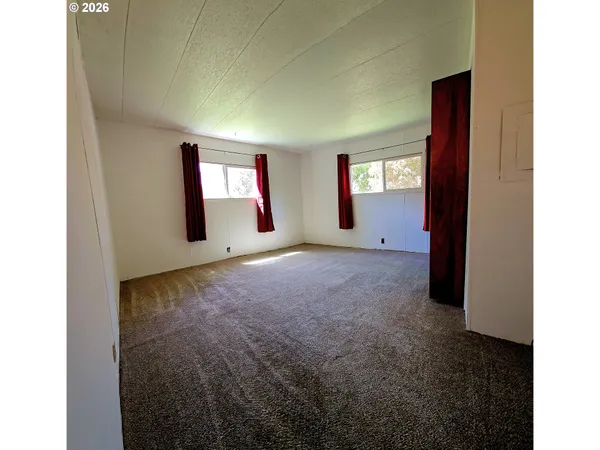 a view of a room with window and stairs