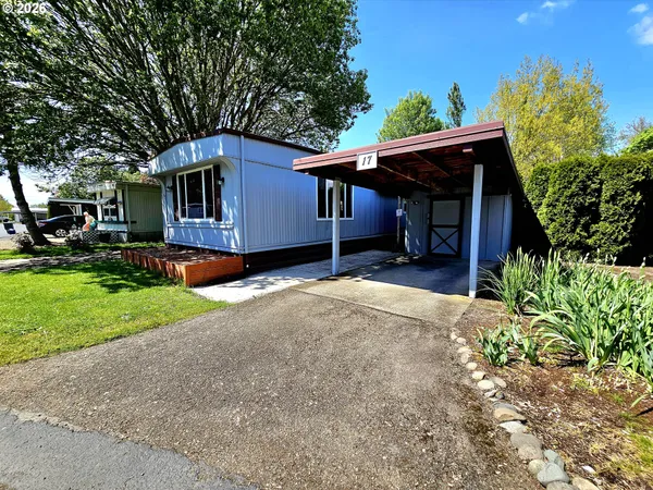 a house with trees in the background