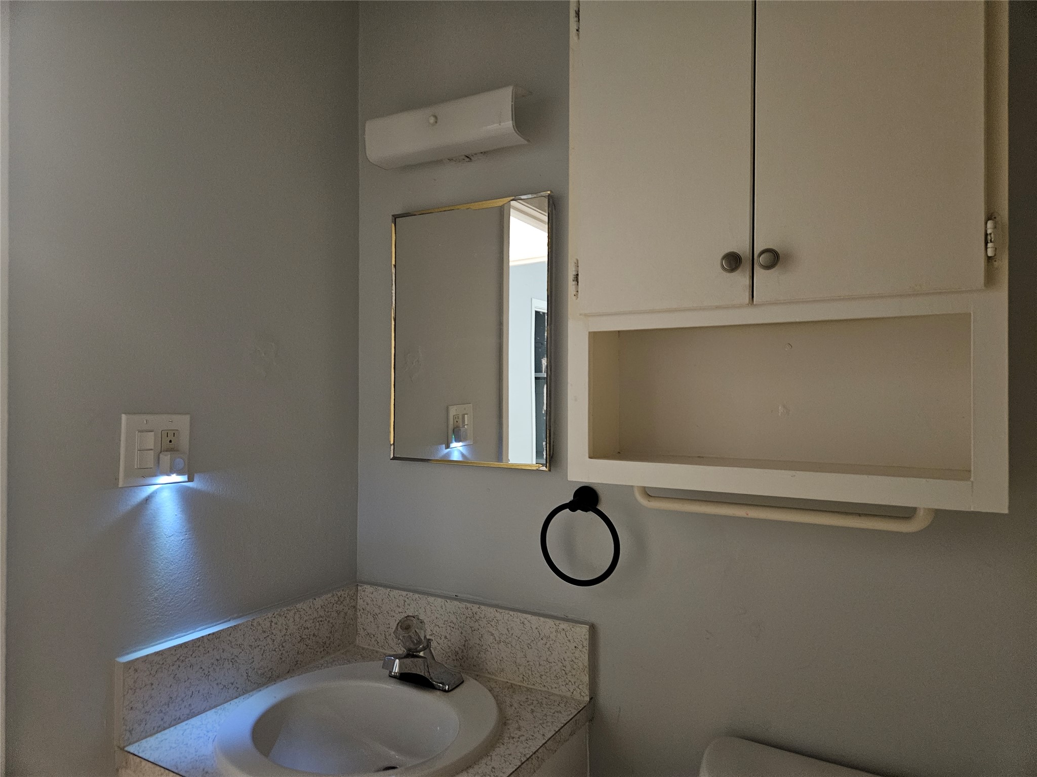 806 Ranch Road, Unit A Georgetown, TX 78628 - Photo 21 of 24 A well-lit vanity area offers functional storage and a classic sink.
