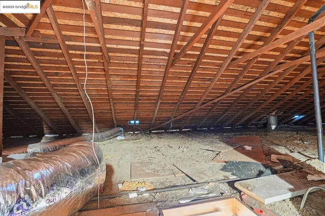 a view of a room with wooden walls