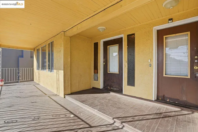 a view of a front door and wooden floor