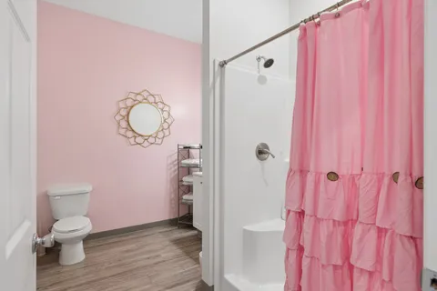 a bathroom with a shower curtain