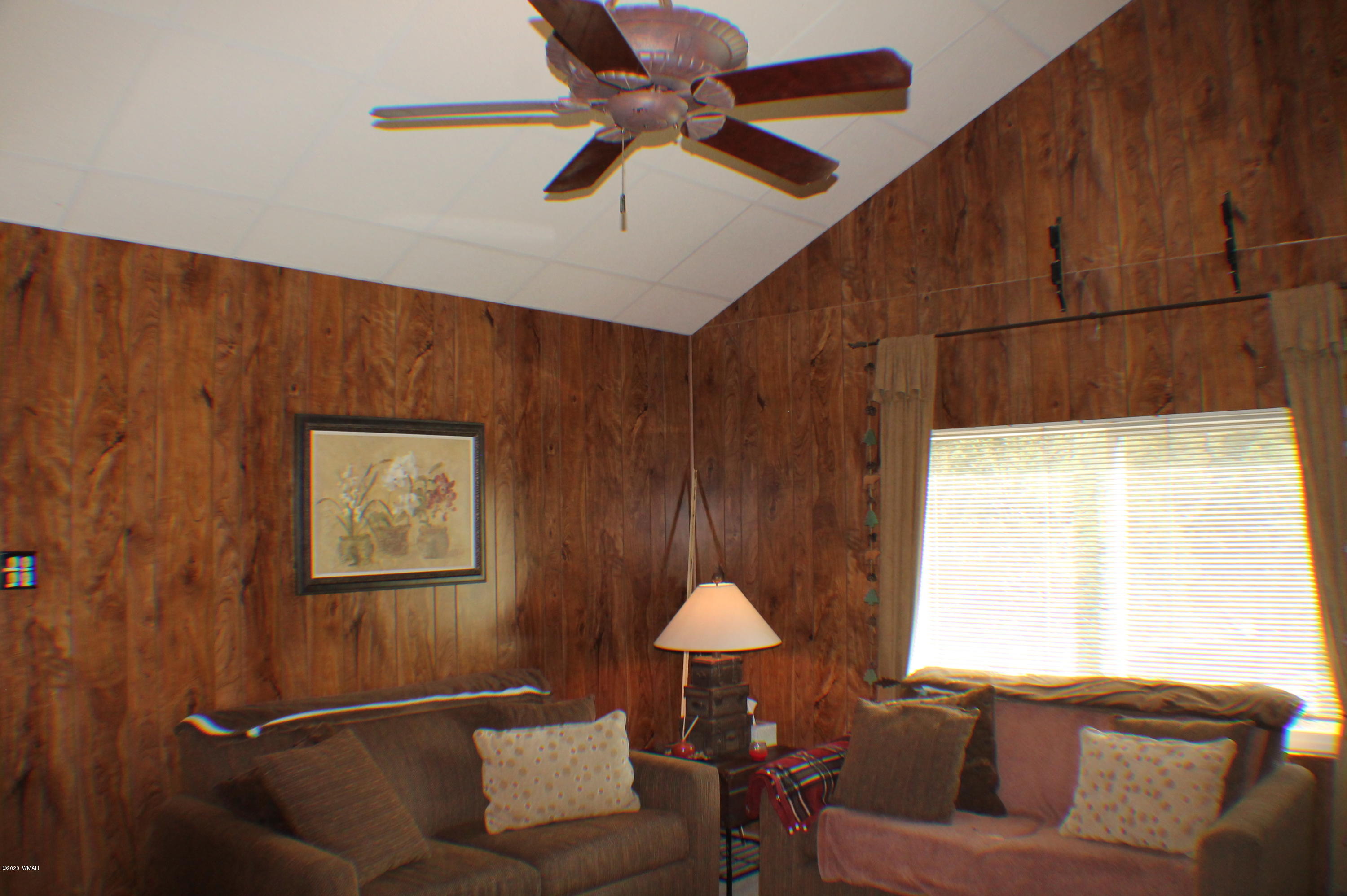 2048 Gilbert Lane Overgaard, AZ 85933 - Photo 13 of 41 a living room with furniture and a window