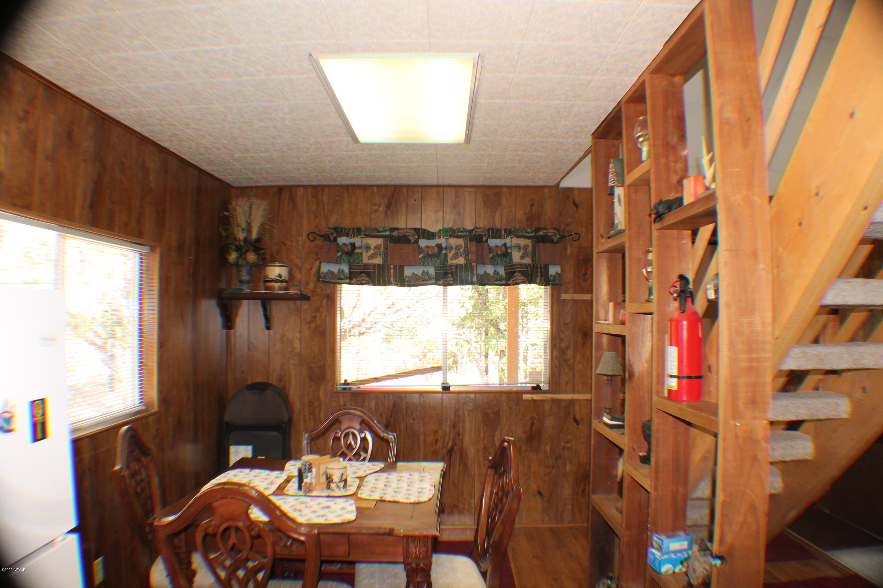 2048 Gilbert Lane Overgaard, AZ 85933 - Photo 17 of 41 a view of a dining room with furniture window and wooden floor