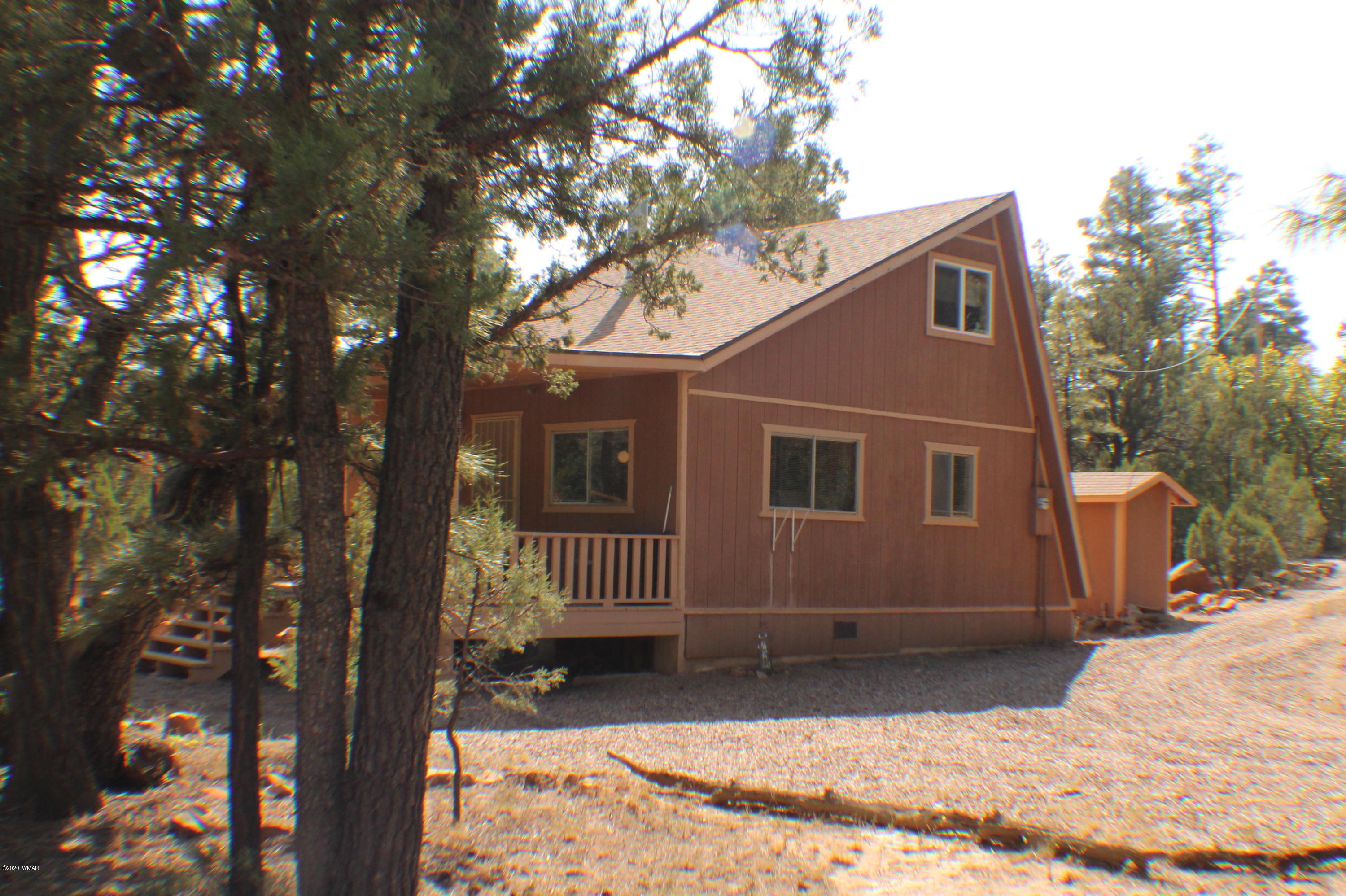 2048 Gilbert Lane Overgaard, AZ 85933 - Photo 4 of 41 a view of a house with a tree in the background