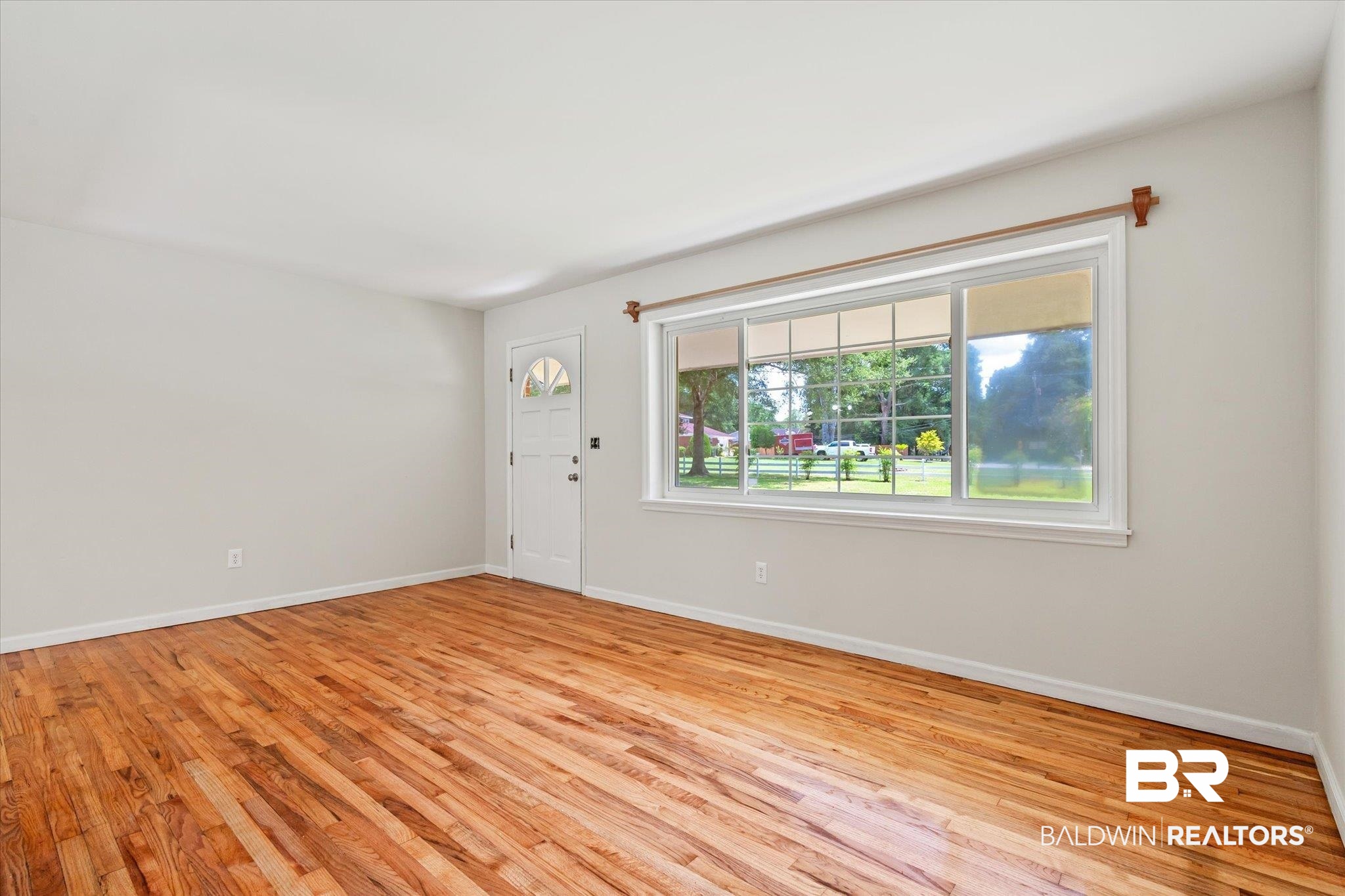 3325 Lacoste Road Mobile, AL 36618 - Photo 3 of 35 Unfurnished room with light hardwood / wood-style flooring