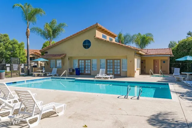 a front view of a house with a yard and porch