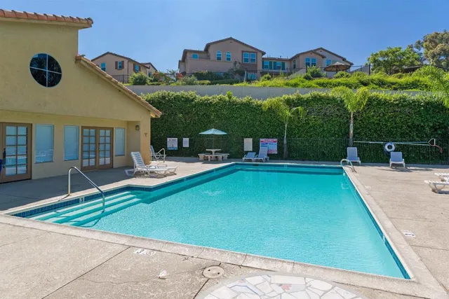 a view of a swimming pool with a patio