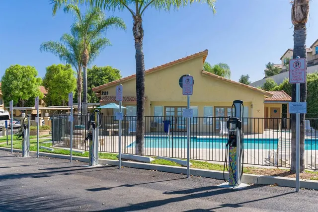 a view of a house with a backyard and a patio
