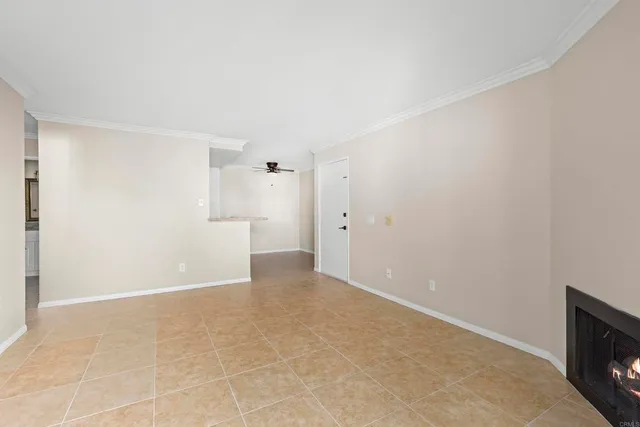 a view of an empty room with a fireplace