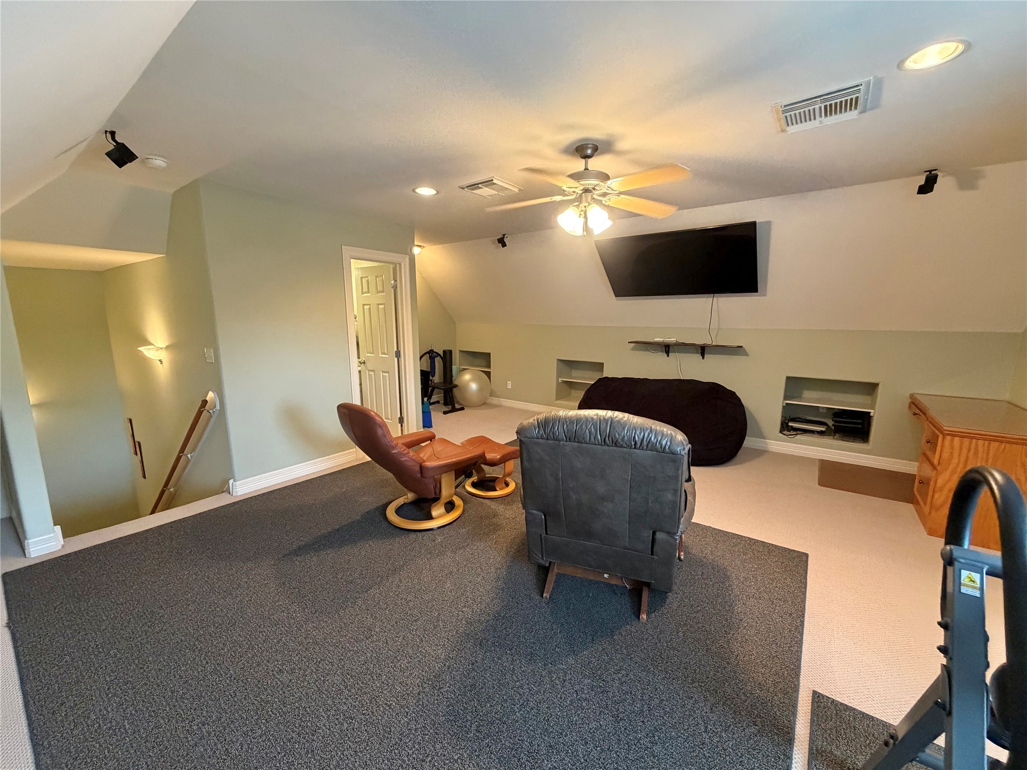 1448 South Blue Bonnet Lane Angleton, TX 77515 - Photo 37 of 43 a living room with furniture a flat screen tv and kitchen view