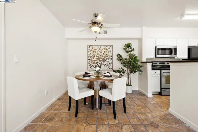a dining room with furniture and window