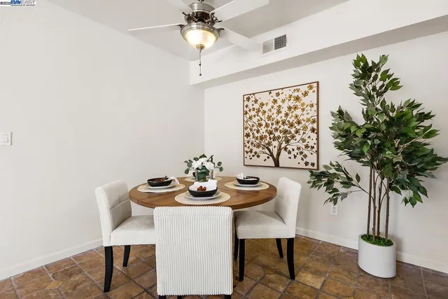 a kitchen with stainless steel appliances granite countertop a stove microwave and refrigerator