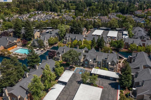 an aerial view of a house with a yard