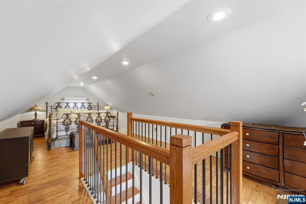 385 Berkeley Avenue Bloomfield, NJ 07003 - Photo 23 of 39 a view of a hallway with wooden floor and staircase