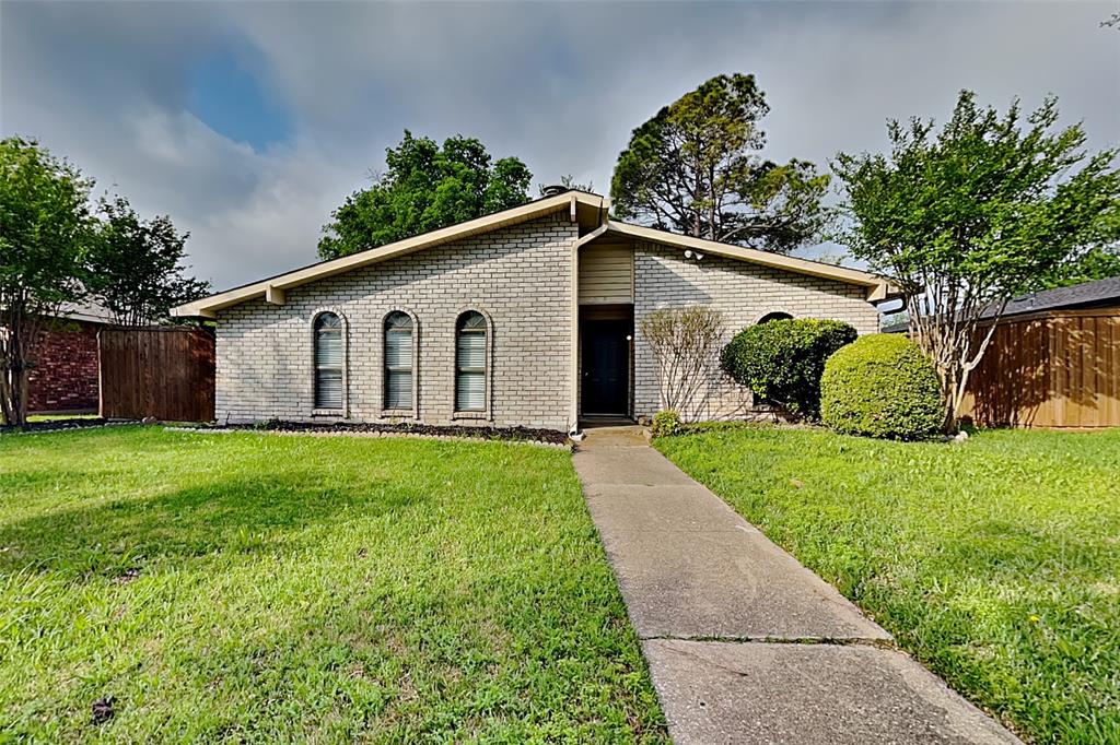 2709 Roman Way Garland, TX 75040 - Photo 1 of 16 a view of a back yard of the house