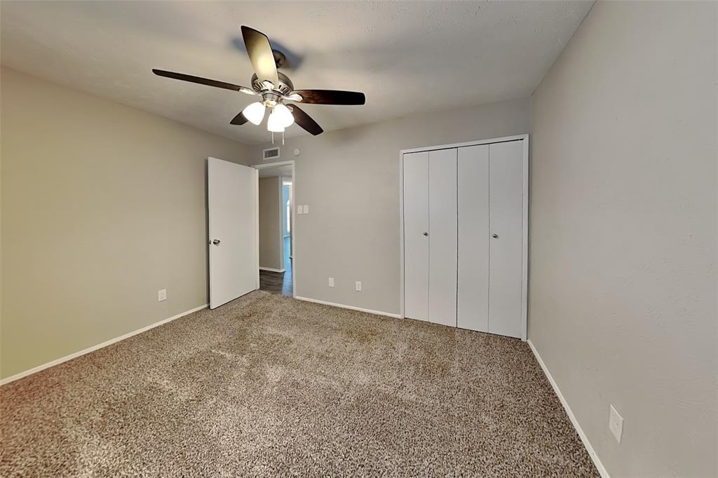 2709 Roman Way Garland, TX 75040 - Photo 12 of 16 a view of an empty room and chandelier fan