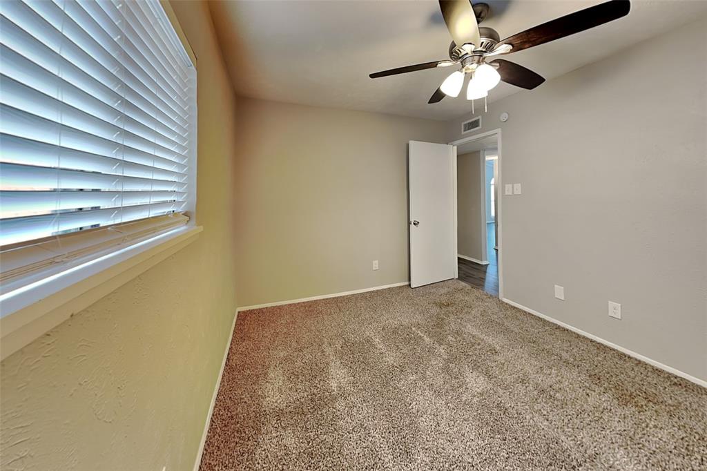 2709 Roman Way Garland, TX 75040 - Photo 13 of 16 a view of a big room with carpet