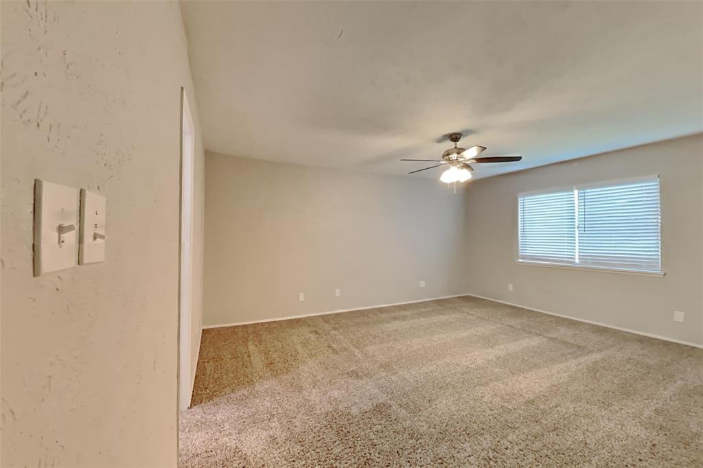 2709 Roman Way Garland, TX 75040 - Photo 8 of 16 a view of an empty room with a window