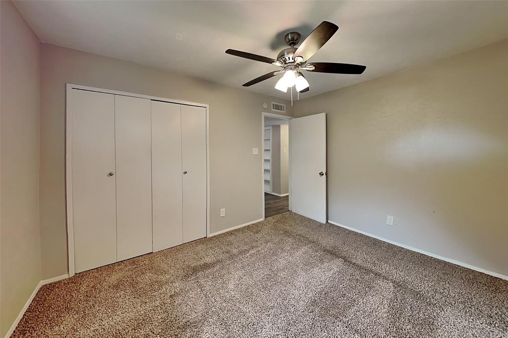 2709 Roman Way Garland, TX 75040 - Photo 10 of 16 a view of an empty room with a chandelier fan