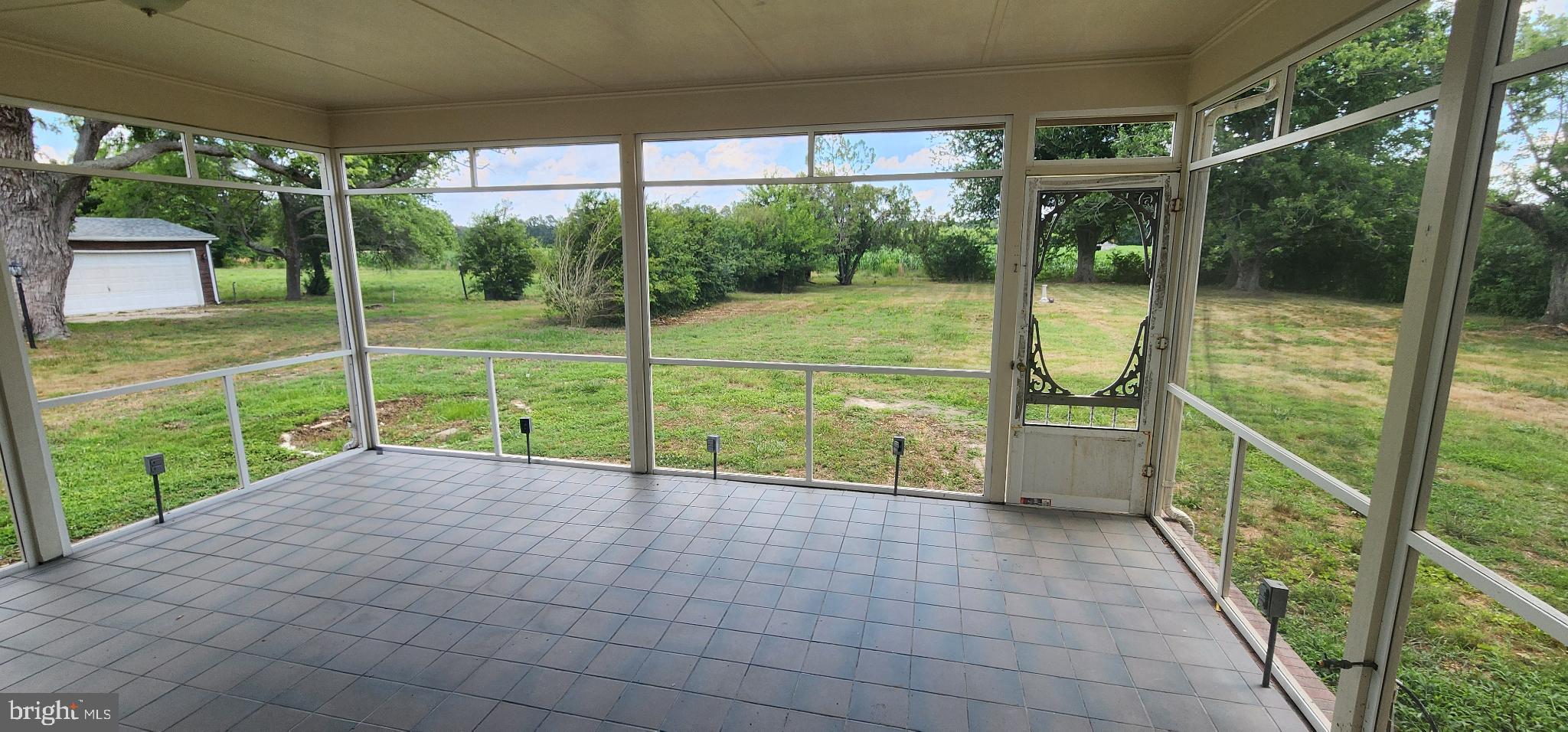 8432 Meadow Bridge Road Eden, MD 21822 - Photo 6 of 42 Serene screened porch with lush views.