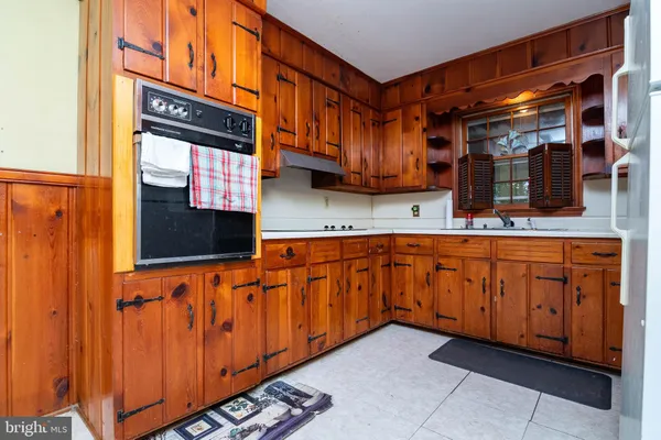 a kitchen with stainless steel appliances granite countertop a sink and cabinets