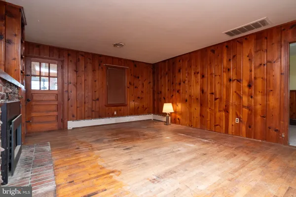 a view of an empty room with a window