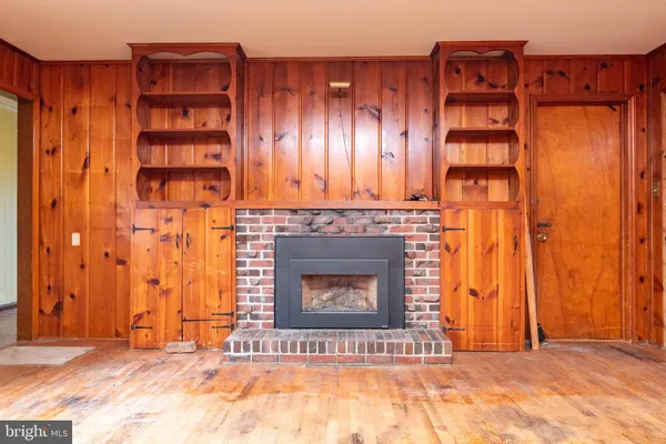 a view of a fireplace with an empty room