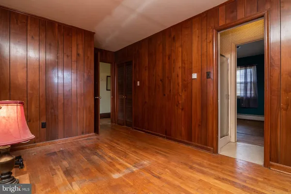 a view of an entryway with wooden walls