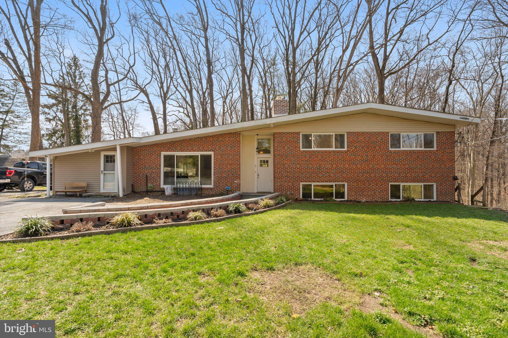 352 South New Middletown Road Media, PA 19063 - Photo 2 of 41 a view of a house with a yard and sitting area