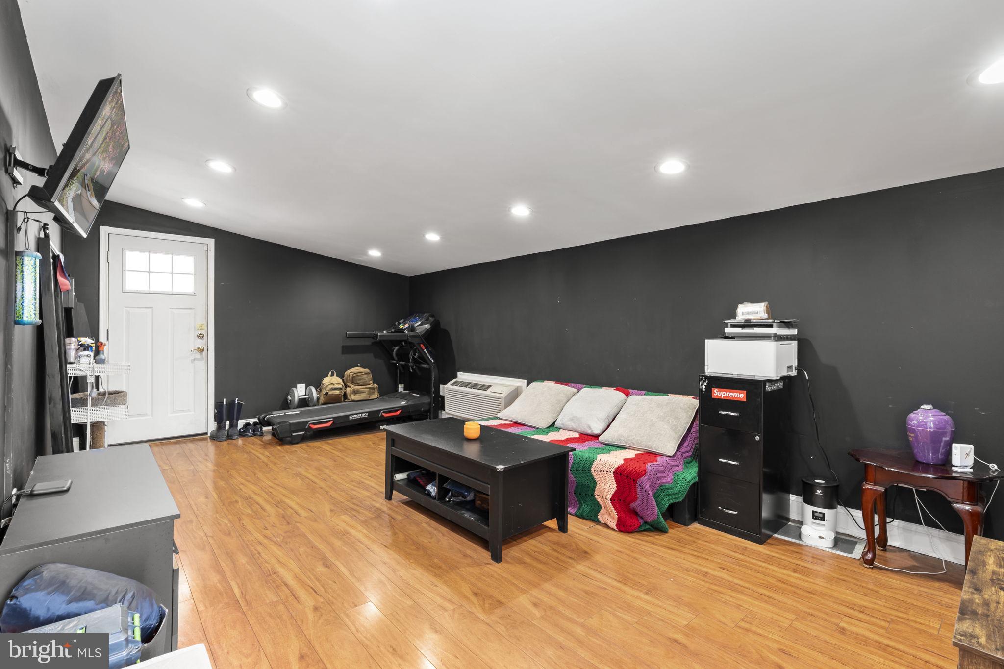 352 South New Middletown Road Media, PA 19063 - Photo 23 of 41 a room with furniture and wooden floor